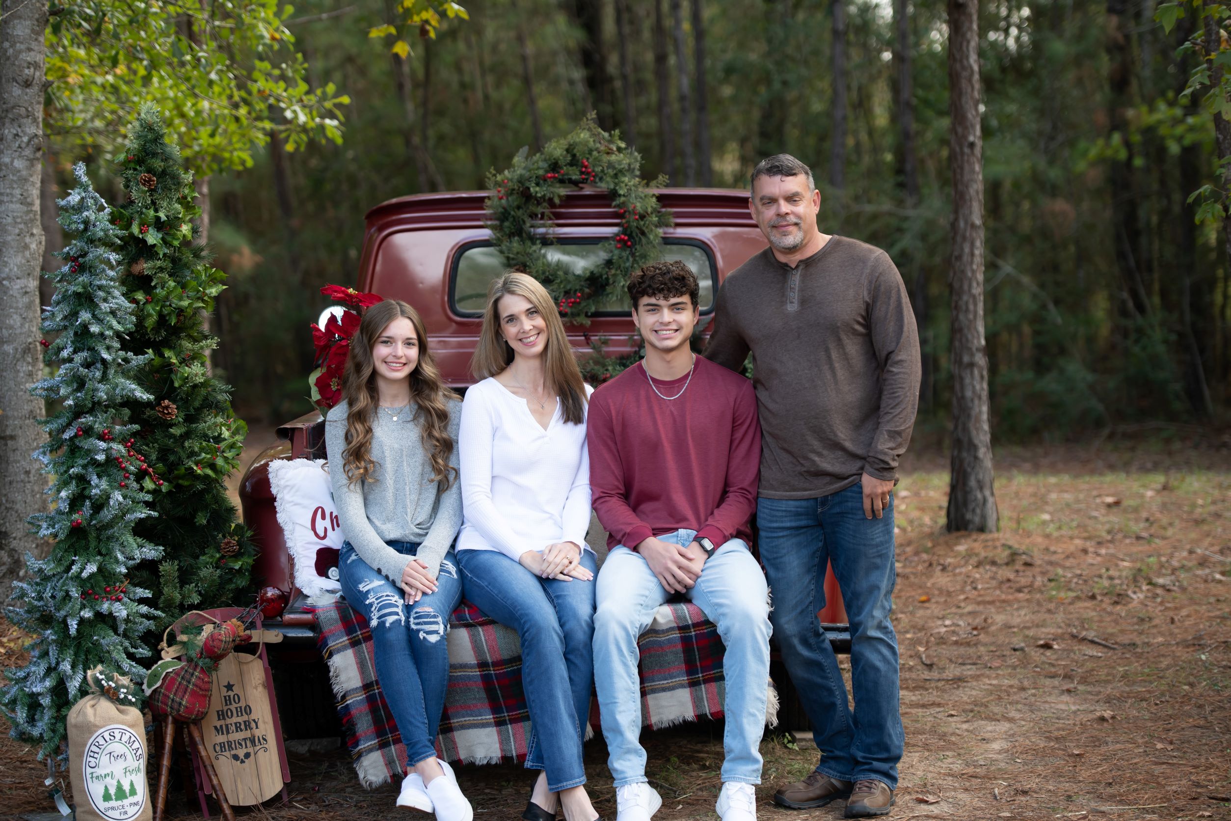 Family picture in forest with Christmas decor